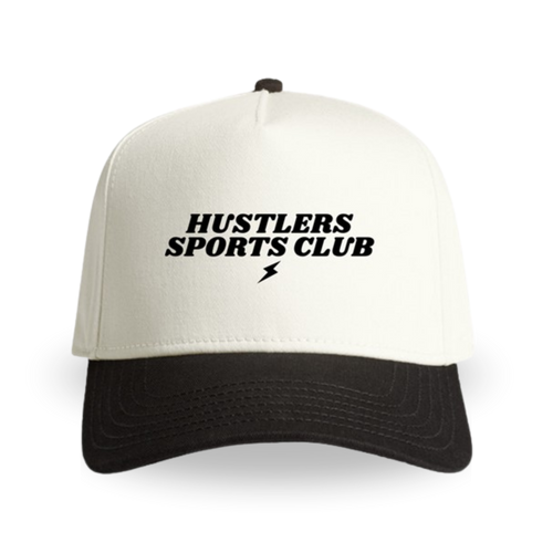 Black-and-cream hat with ‘Hustlers Sports Club’ text and a small lightning bolt logo centered on the front panel.